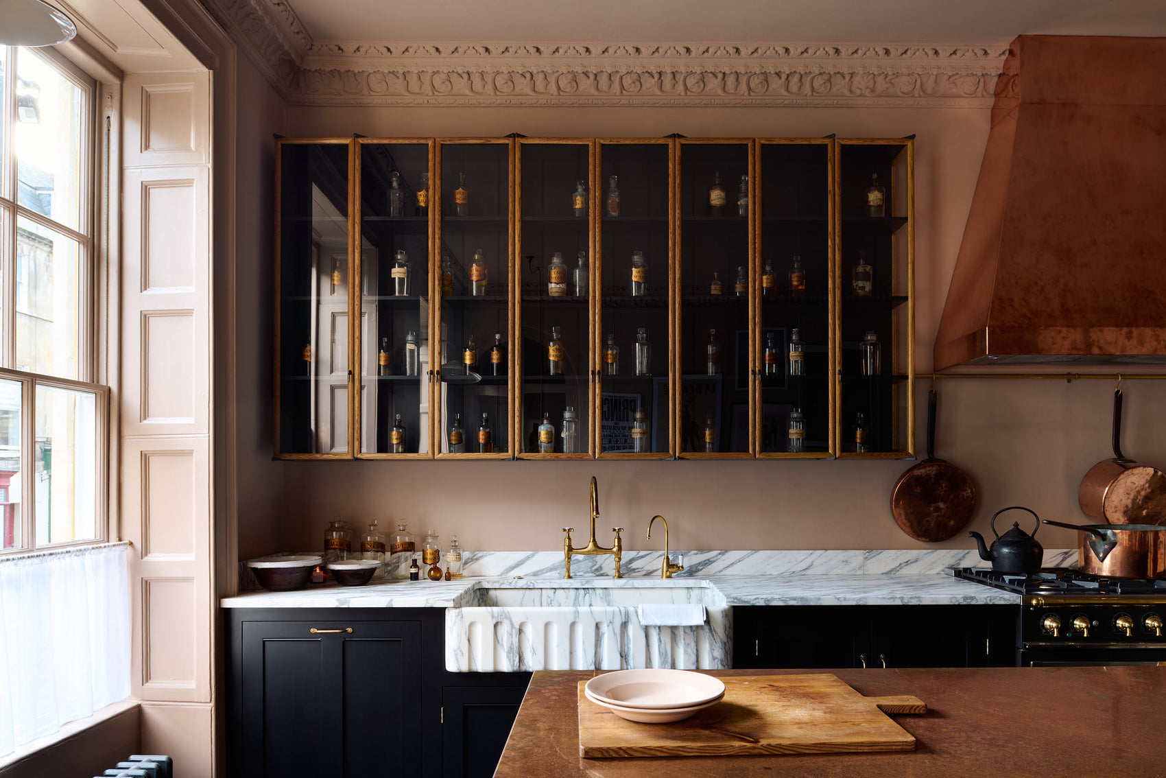 A bold, dramatic Haberdasher’s kitchen with brass details